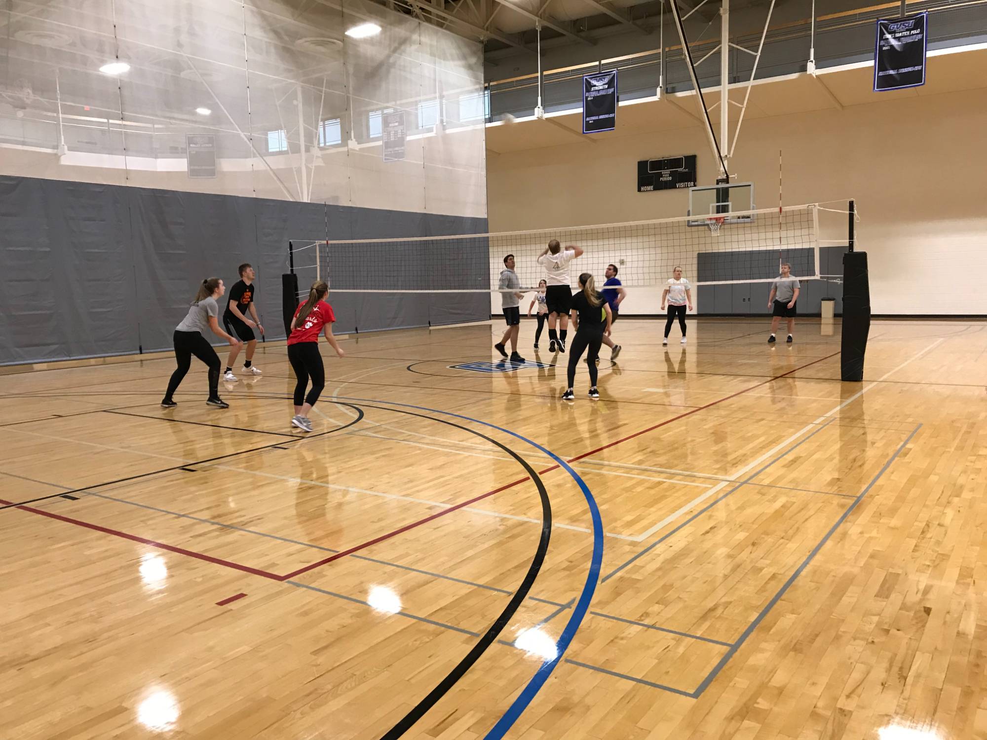 Students playing in volleyball game